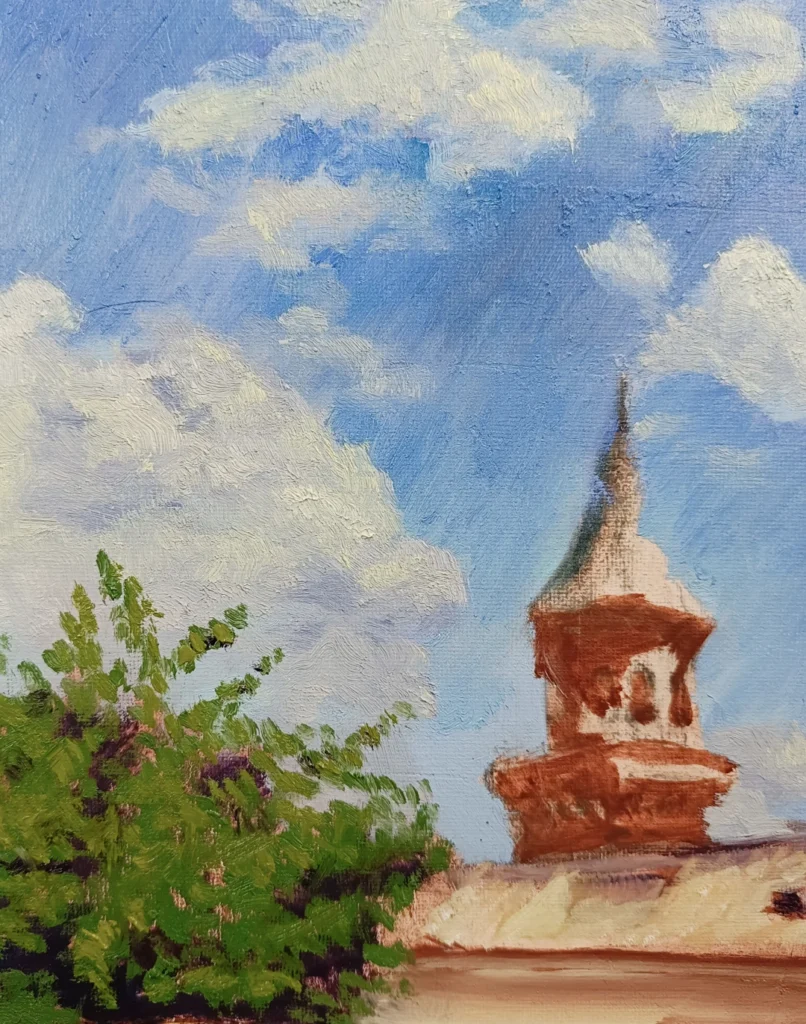 Detalle de cielo azul y nubes en una pintura de paisaje de Las Gabias realizada por Yohan Pixone.