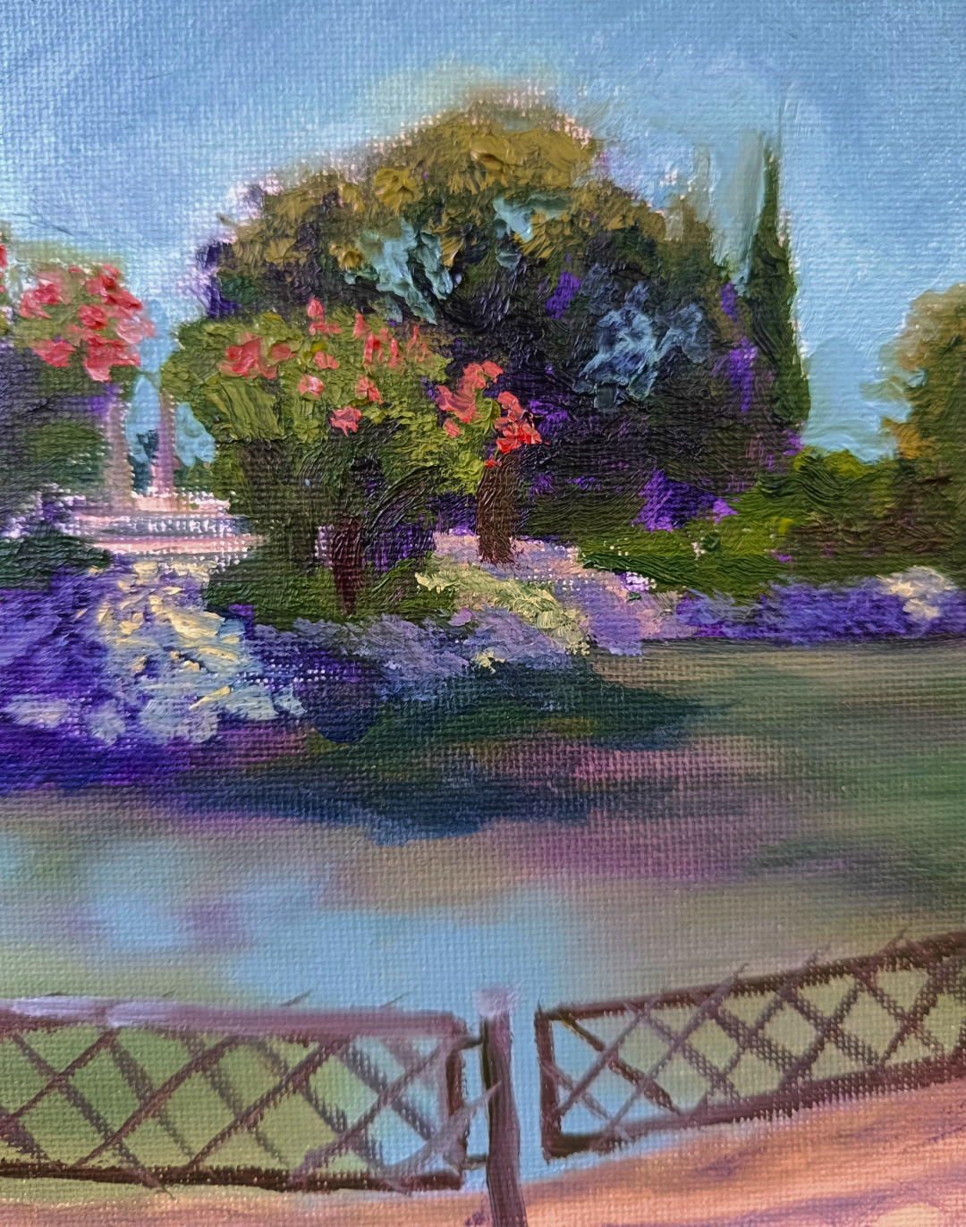 Dos cipreses, pintura al óleo de un estanque con vegetación y reflejos realizada por Yohan Pixone en el Parque Federico García Lorca.