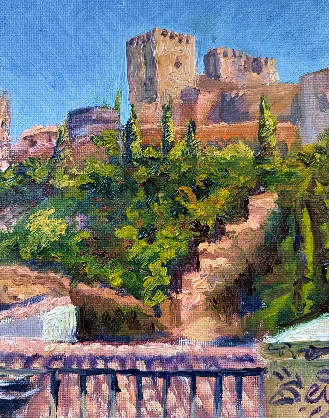 Desde Carvajales, pintura al óleo de Yohan Pixone con la Alhambra vista entre vegetación y tejados desde la Placeta de Carvajales.