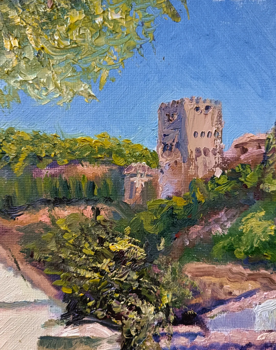 Desde Carvajales, pintura al óleo de Yohan Pixone con la Alhambra vista entre vegetación y tejados desde la Placeta de Carvajales.